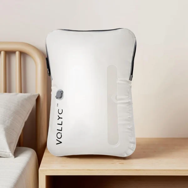 25L packable vacuum storage bag in nylon, shown compressed flat beside a full bag of clothes