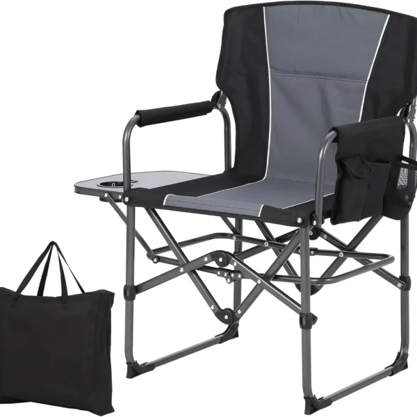 Oversized directors camping chair in black with attached side table and pocket at a campsite