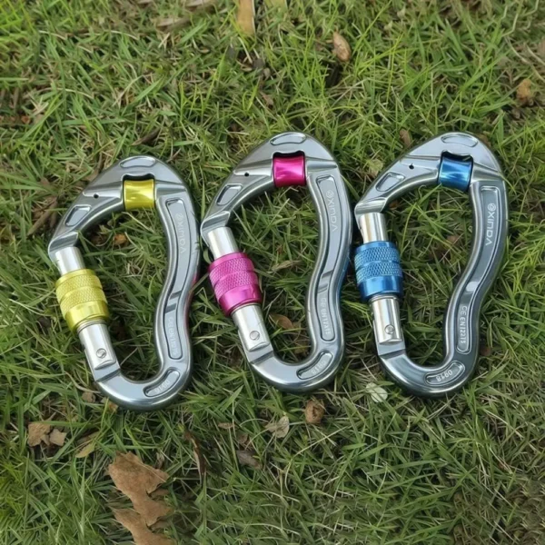 Orange carabiner with pulley wheel and threaded screwgate lock shown with a rope running through it