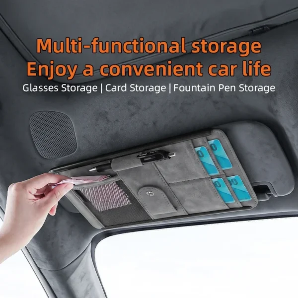 Khaki suede sun visor organizer with cards and sunglasses fitted on a car visor