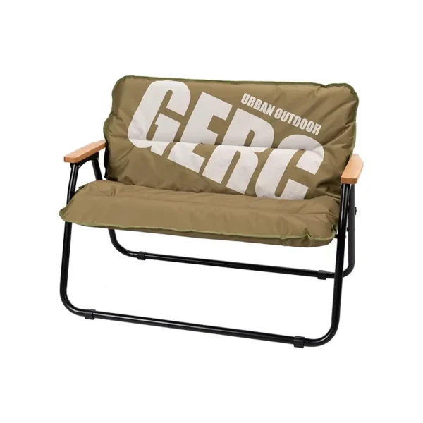 Double aluminum folding chair in olive Kermit style with backrest set up at a campsite