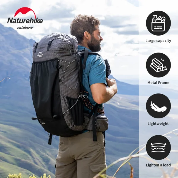 60L camping backpack in nylon with its rain cover fitted, carried on a mountain trail