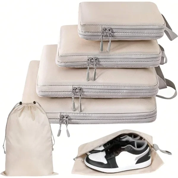 Compressible packing cube set in lake blue with matching handbag and several rectangular zip cubes