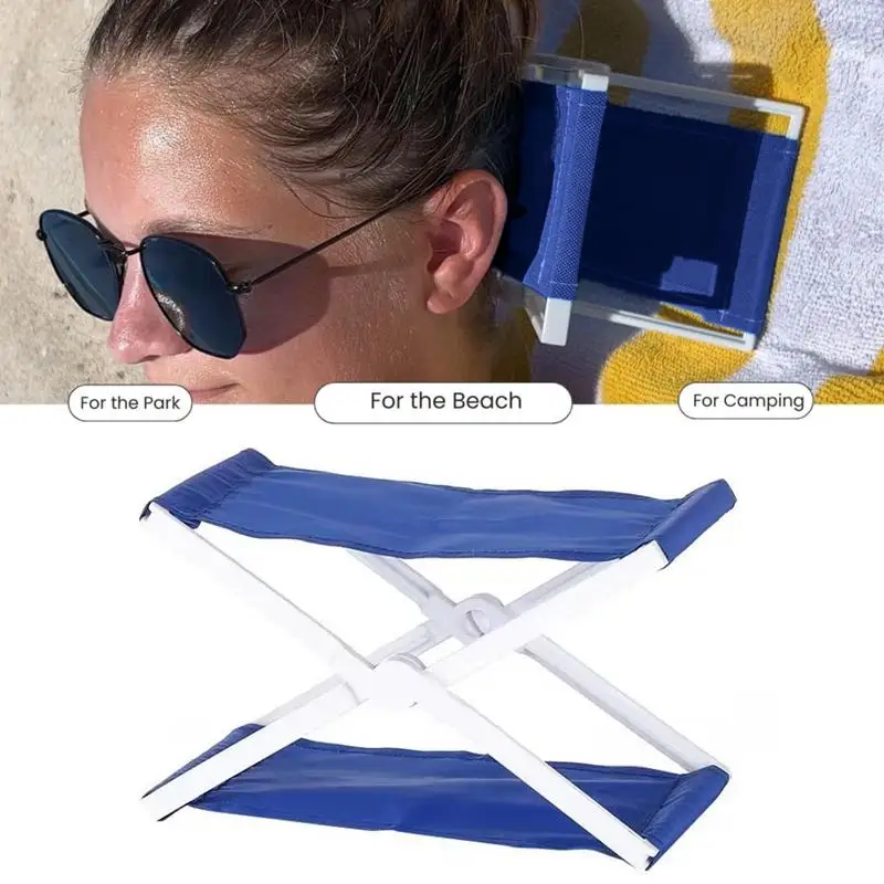 Foldable Camp Pillow Compact Ergonomic Neck Support Pillow 1 Foldable camp pillow in blue with ergonomic neck support shape on a camping sleeping bag