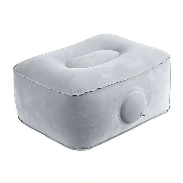 Inflatable travel foot rest pillow fully inflated under a seat for leg support on a long trip