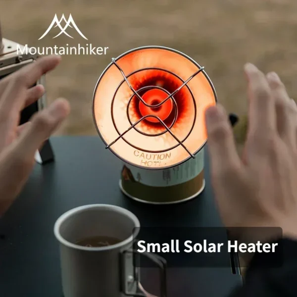 Stainless steel portable butane heater mounted on a gas canister at a campsite
