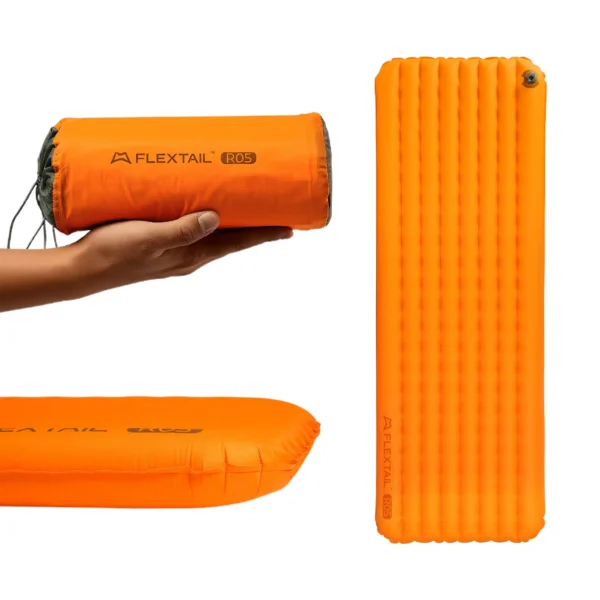Insulated inflatable sleeping pad unrolled on a tent floor showing its 196 cm length and nylon surface