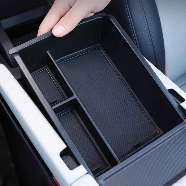 Armrest cup holder organizer sitting inside the center console of a BYD Seal U