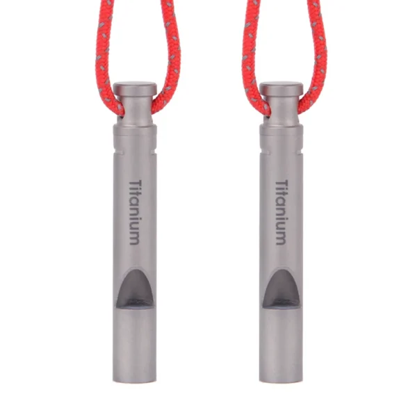 Titanium emergency whistle with carry cord shown on a hiking backpack shoulder strap