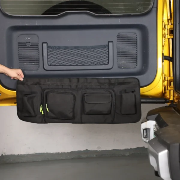 Black tailgate tool storage bag mounted inside the rear hatch of a BYD Leopard 5