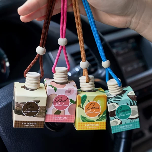 Liquid car air freshener perfume diffuser bottle displayed inside a car