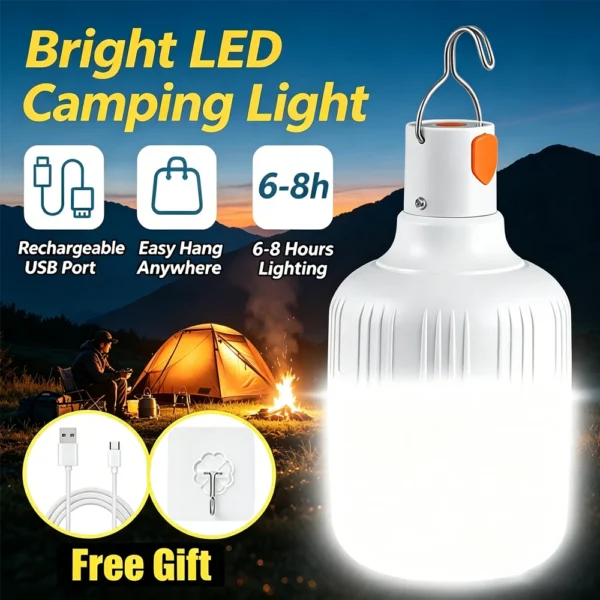 USB rechargeable LED camping light bulb hanging by its hook from a tent loop at night