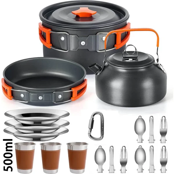 Camping cooking set with aluminum pot, frying pan and kettle next to a mesh bag at camp