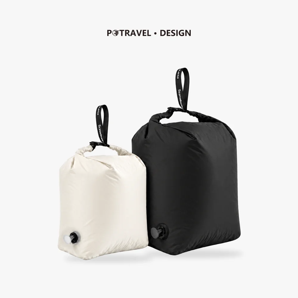 Roll Top Compression Bag with One-Way Valve, TPU Laminated Nylon 1 Gray roll top compression bag with buckle closure and one-way valve holding a down jacket