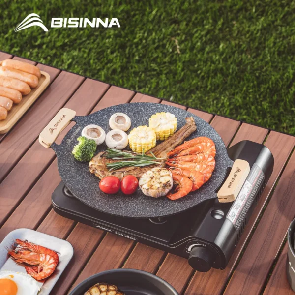 Camping grill pan 30cm with non-stick surface and wooden handles, shown from above
