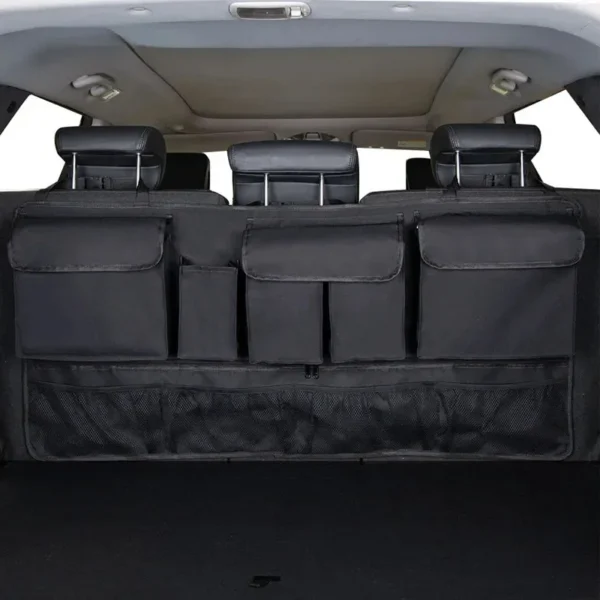 Hanging trunk storage bag in black Oxford fabric mounted on a car back seat
