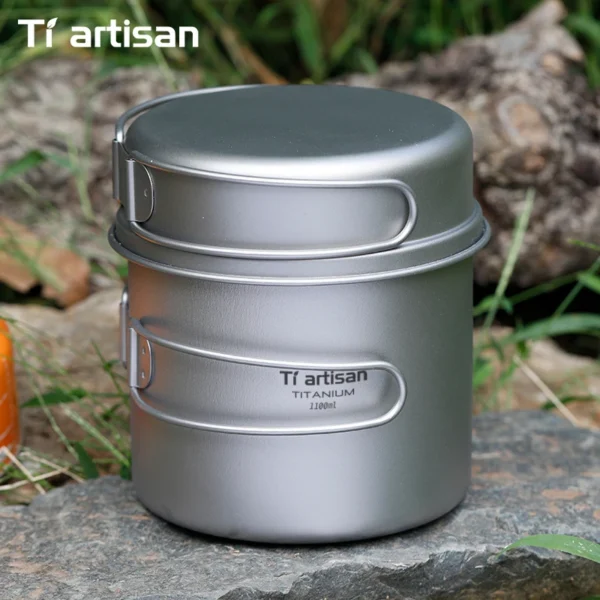 Long handle titanium cookset showing a titanium pot and frying pan with folding handles extended
