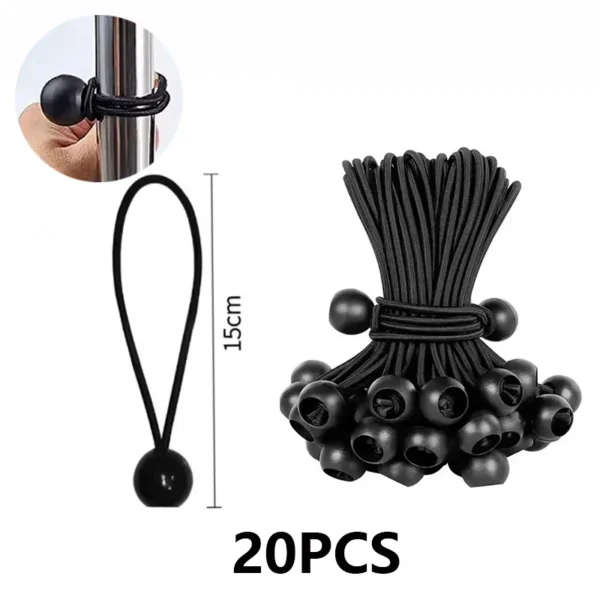 Pile of elastic rope ball ties with plastic balls next to a folded camping tarp and tent