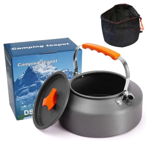 Anodized aluminum camping kettle with plastic handle sitting on a camp stove outdoors