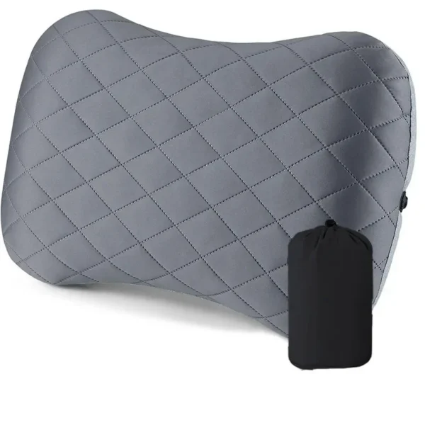 Inflatable backpacking pillow with green washable cover strapped to an inflatable sleeping pad
