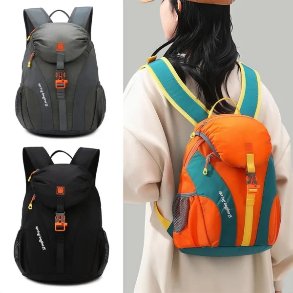 Small hiking daypack in orange nylon with front zip pockets and mesh shoulder straps